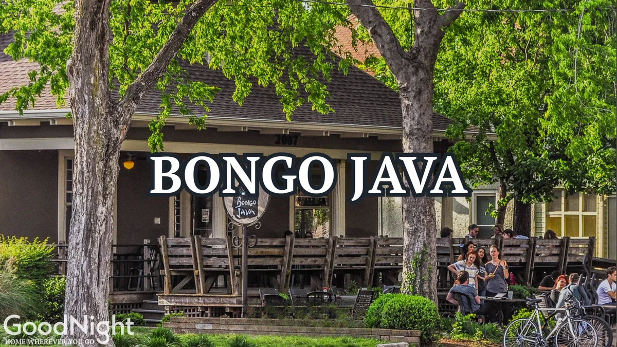 The exterior of Bongo Java, a beloved local coffee shop, featuring its recognizable sign, outdoor seating area, and people enjoying coffee and conversation in a friendly, welcoming atmosphere.